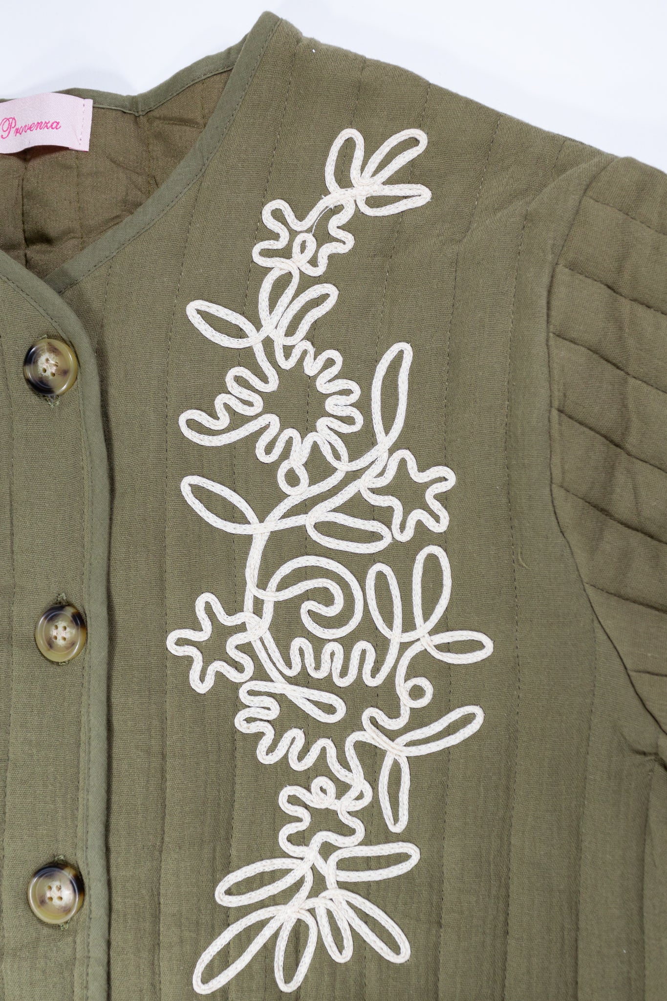 Chaqueta bordada verde oliva con diseño floral